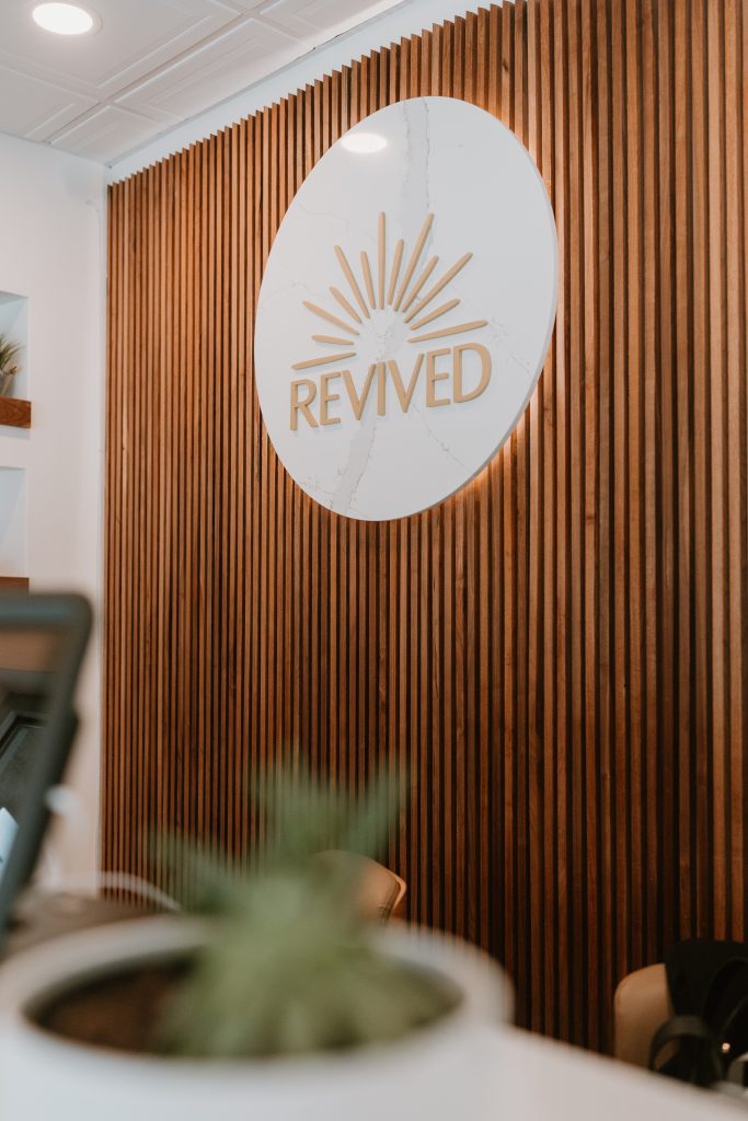 revived camp hill front desk wooden wall